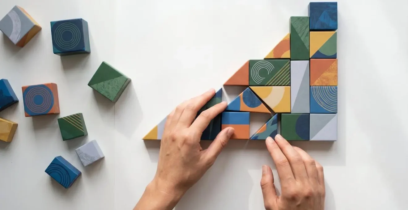 Overhead view of a modern workspace with content blocks being assembled like puzzle pieces